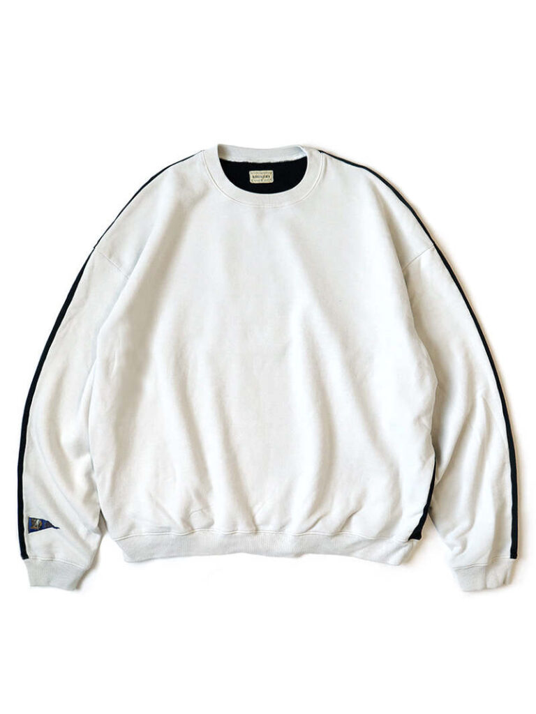 Front view of the KAPITAL Men’s Sweat Knit 2Tones Remake Big Sweatshirt in Ecru and Black, showing the clean ecru front panel with subtle black side inserts running along the sleeves, ribbed cuffs and hem, and an oversized relaxed silhouette.