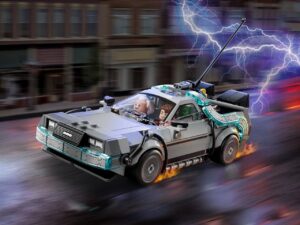 LEGO Back to the Future Time Machine set featuring Doc Brown and Marty McFly minifigures driving the iconic silver DeLorean with lightning effects and flaming tire trails, capturing the cinematic moment of time travel in motion.