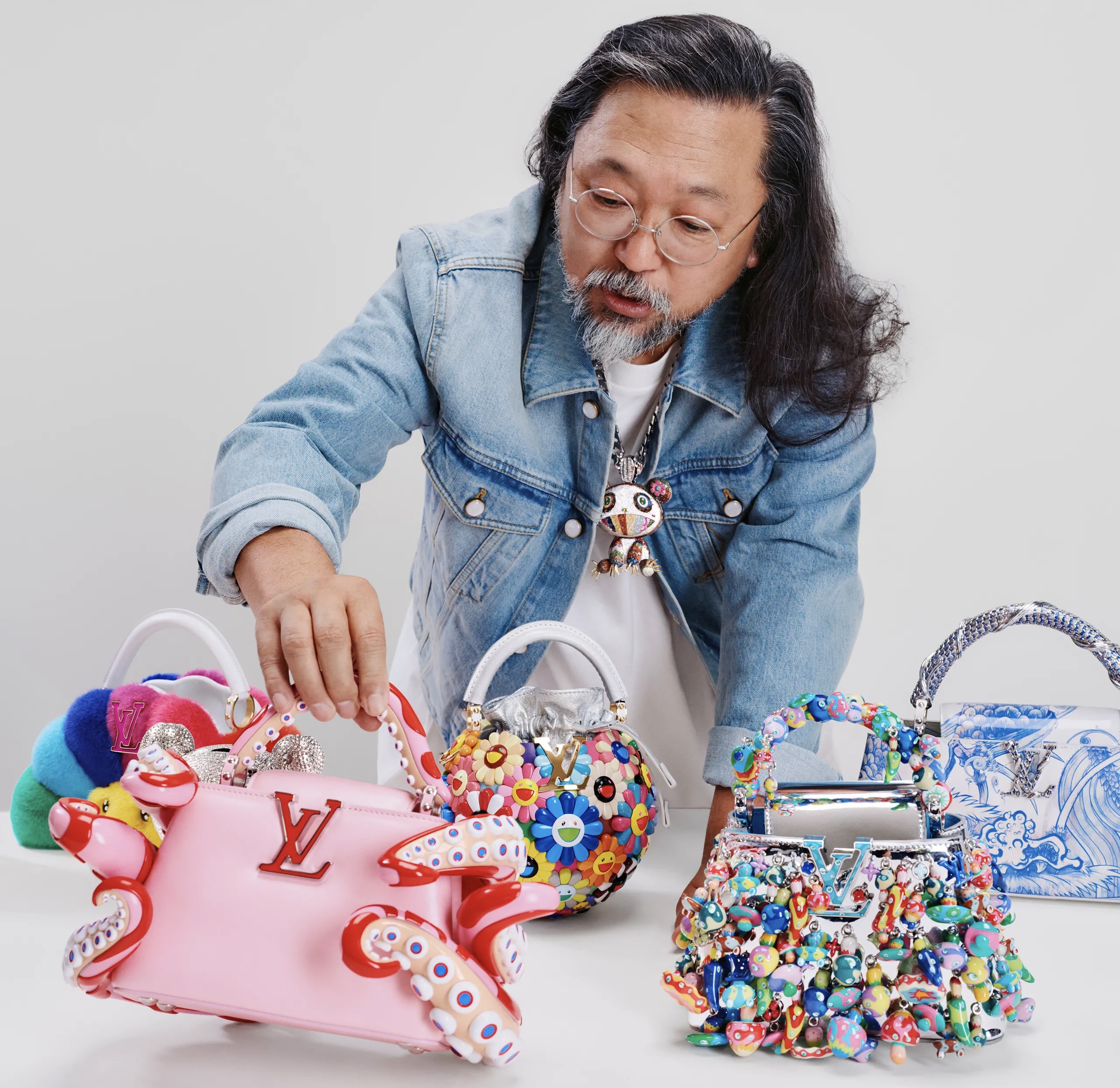 Takashi Murakami portrait by Rodrigo Carmuega for Louis Vuitton Artycapucines VII; Louis Vuitton Capucines GM Souple front view; installation detail from Art Basel Paris 2025 featuring Murakami’s smiling flower motifs and Capucines display