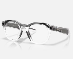 Transparent Oakley Meta HSTN smart glasses with clear lenses, showcasing embedded side cameras and sleek modern frame design.
