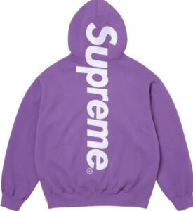Back view of the Supreme Satin Appliqué Hoodie in deep purple, featuring a bold vertical white “Supreme” logo running down the hood and back. The heavyweight cotton fleece and ribbed cuffs highlight the brand’s signature streetwear craftsmanship from the FW25 collection.