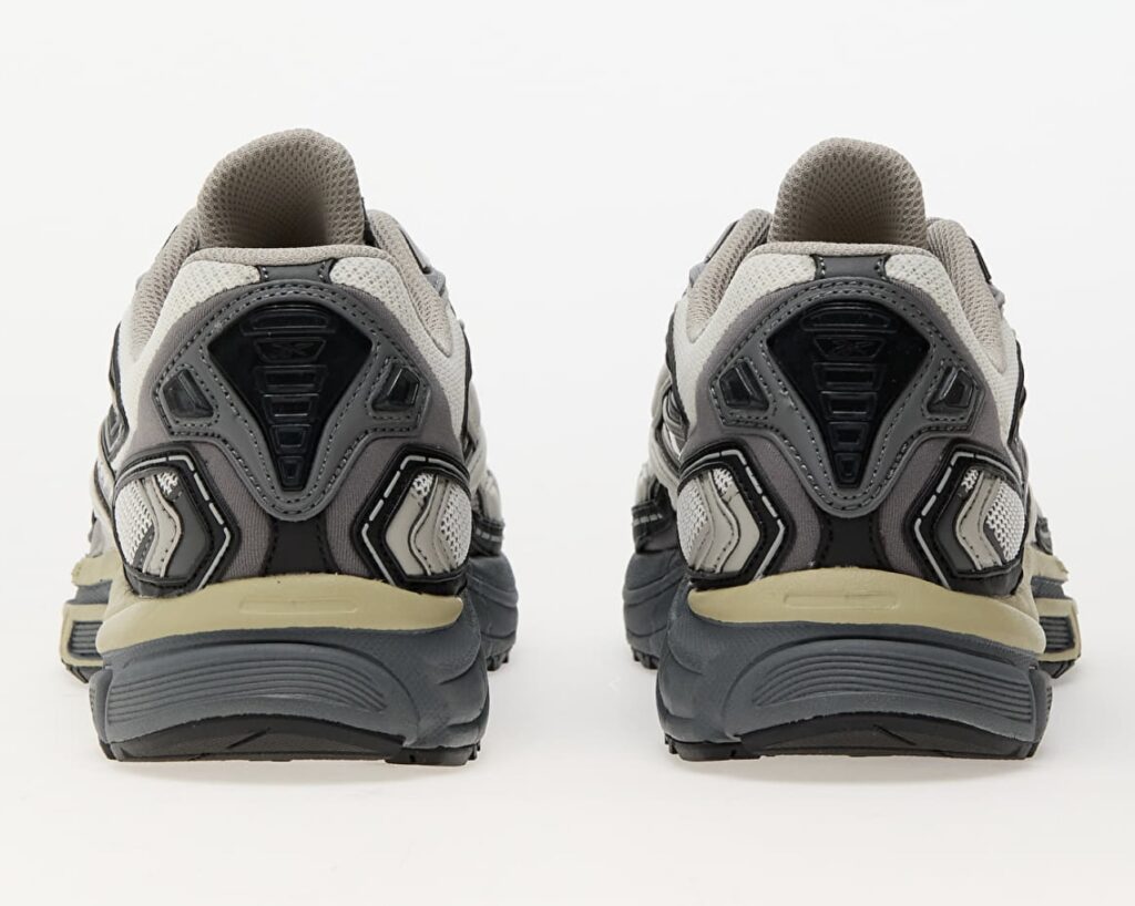 Rear view of the Reebok Premier Road Ultra Tonal Grey sneakers, highlighting the layered heel construction in grey and black with reflective detailing, mesh ventilation panels, and cushioned midsoles for stability and support.