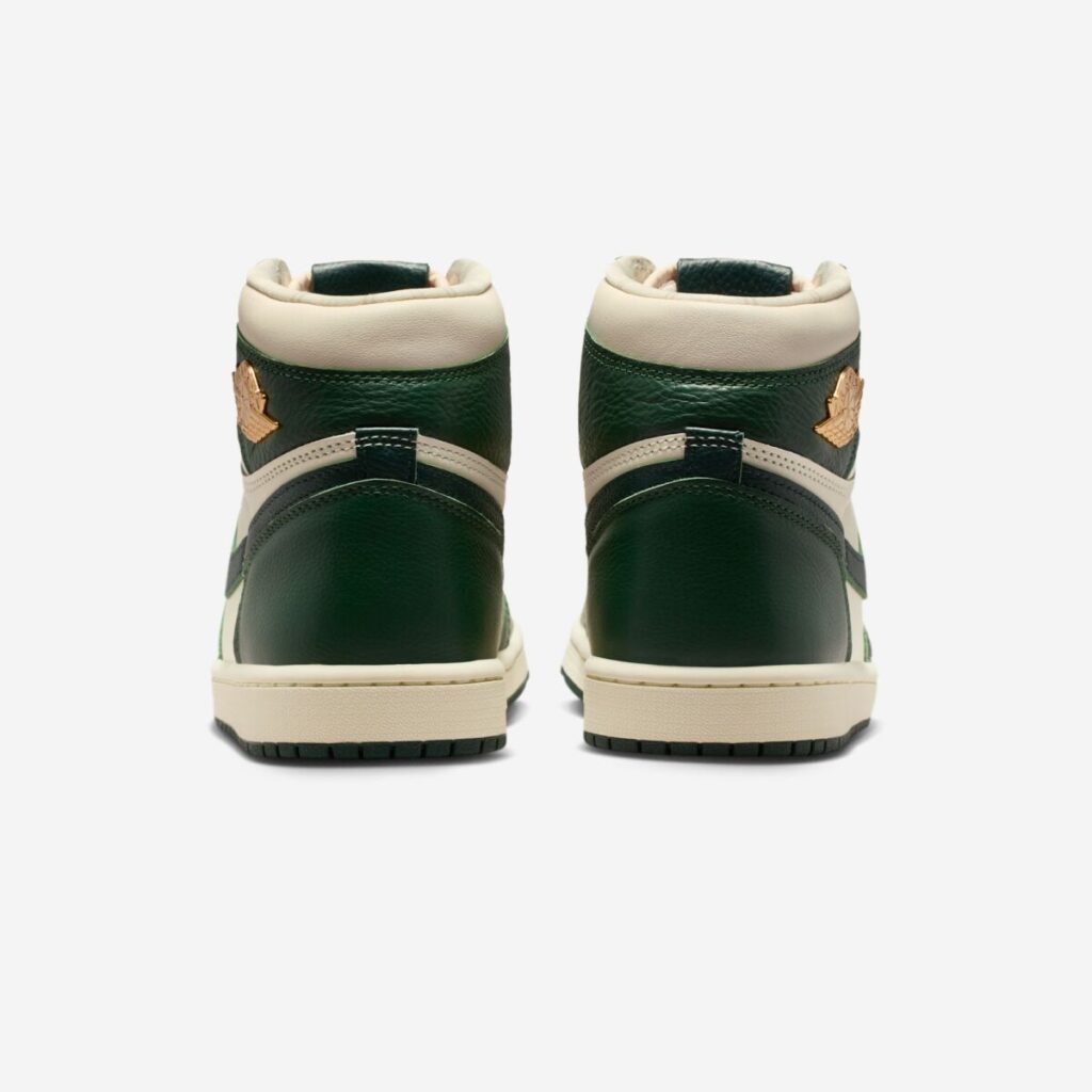 Rear view of the Air Jordan 1 High OG WMNS “Fir,” showing the Fir Green leather heel panels, Pale Ivory collar padding, cream midsoles, and gold Wings logos on the upper ankle sections.