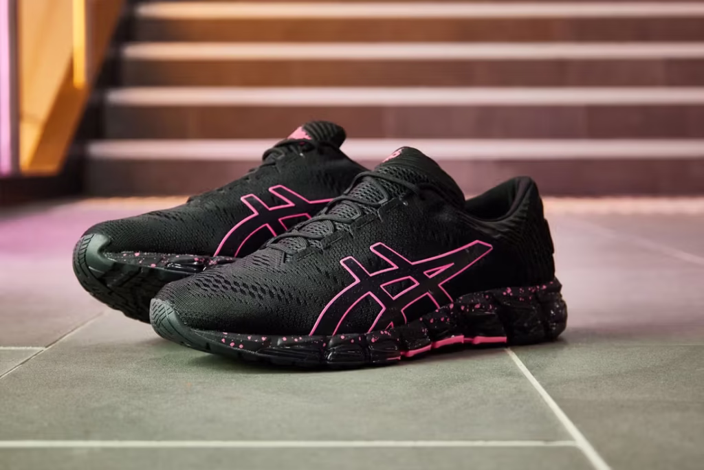 Close-up image of the ASICS GEL-QUANTUM 360 5 “Tokyo Neon” sneaker in its bright variant. The shoe features a white upper with vivid neon green, orange, and pink accents inspired by Tokyo’s glowing nightlife. Its full-length GEL cushioning is visible through the translucent midsole, while reflective overlays highlight the dynamic, futuristic design lines characteristic of ASICS performance footwear.