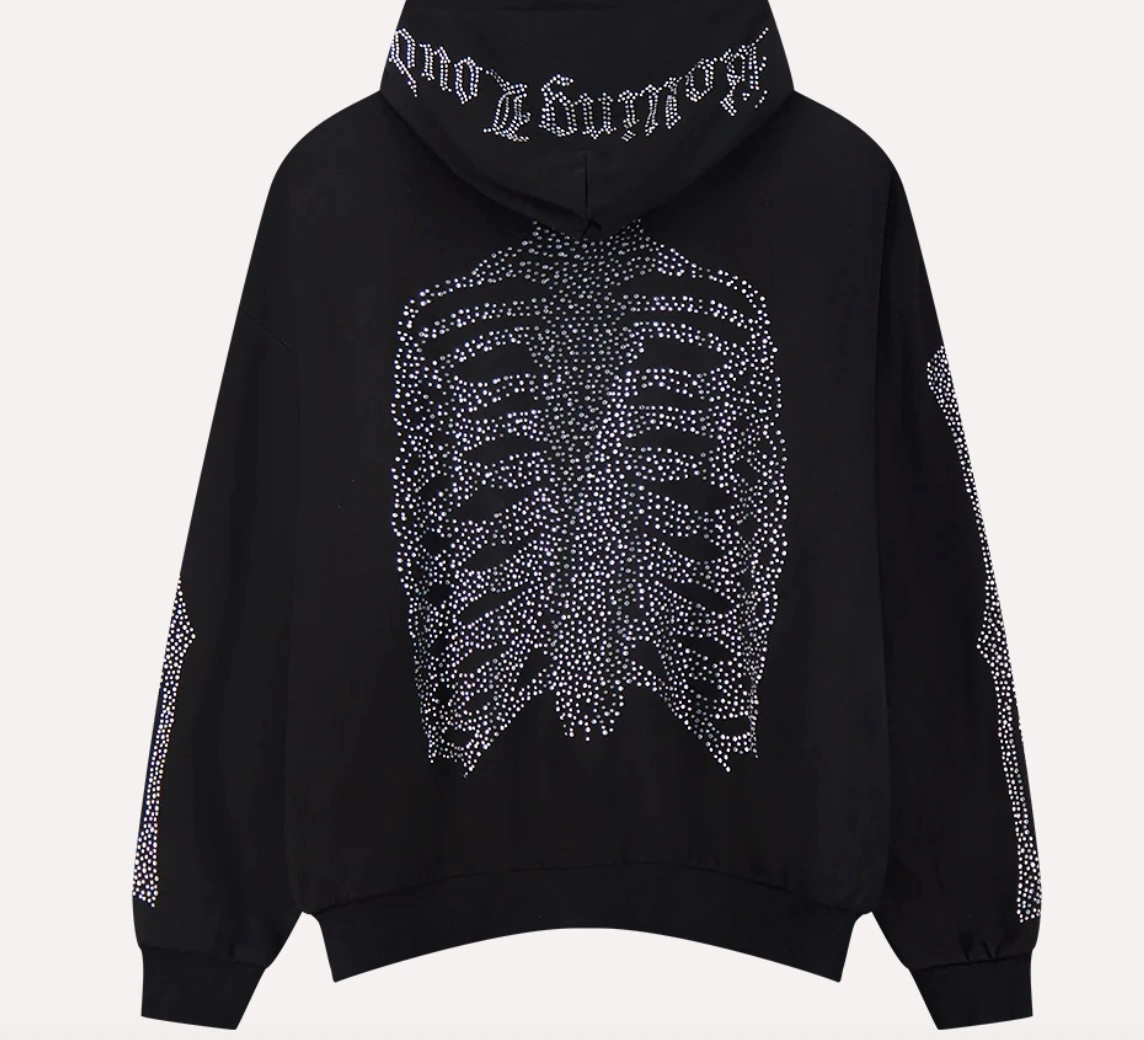 Back view of the Rolling Loud WEATSHIRT RL Bones Zip Up Hoodie featuring a rhinestone skeleton ribcage graphic and gothic “Rolling Loud” lettering across the hood on black fleece fabric.
