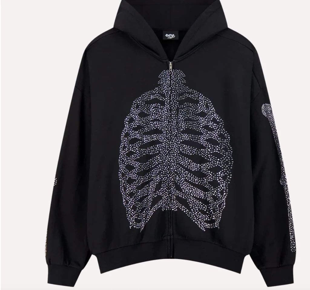 Front view of the black Rolling Loud WEATSHIRT RL Bones Zip Up Hoodie featuring a rhinestone-embellished ribcage design across the chest and sleeves, with a minimalist zip-front closure and relaxed streetwear fit.