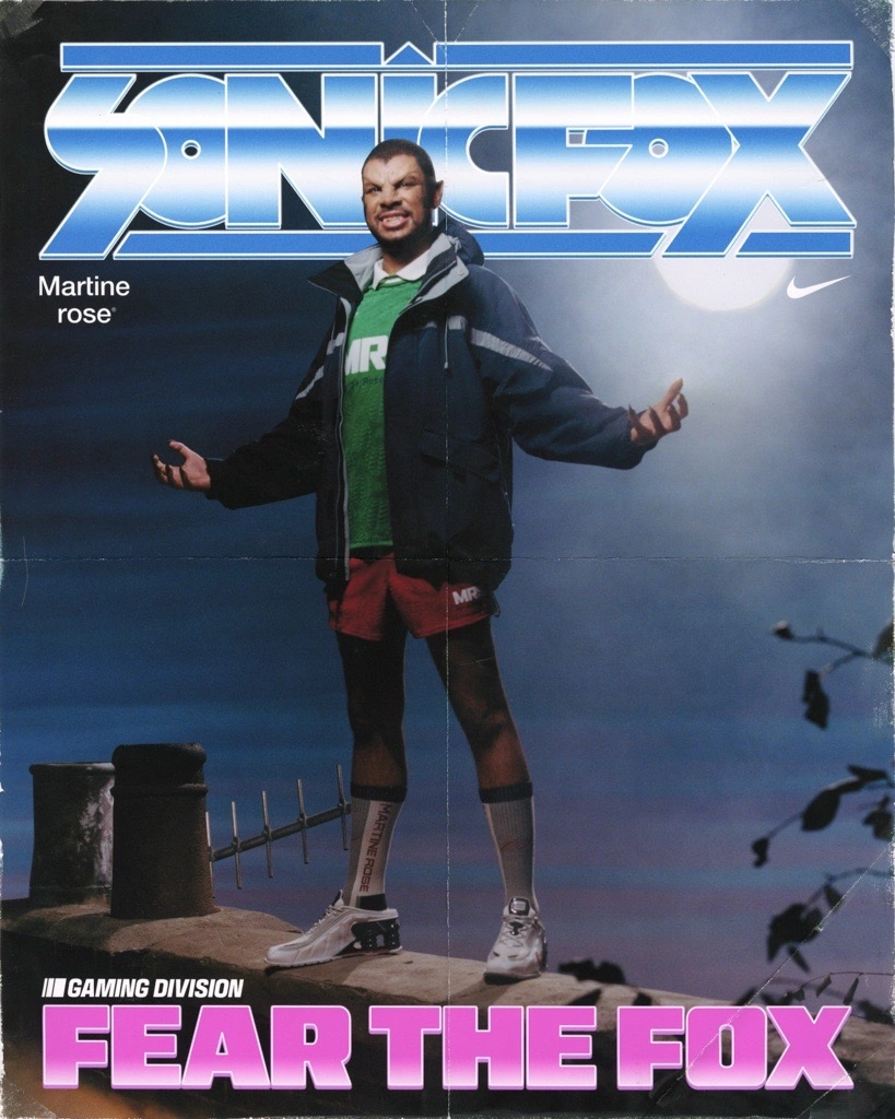 Promotional image from the Nike × Martine Rose Sport collection featuring gamer and esports icon SonicFox. They stand on a rooftop under a night sky, wearing a layered athletic look including a green “MR” jersey, red shorts, and a navy parka with white Nike × Martine Rose sneakers. The poster’s retro-style typography reads “SONICFOX” and “FEAR THE FOX,” evoking vintage sports-magazine aesthetics that blend gaming culture with athletic heroism.