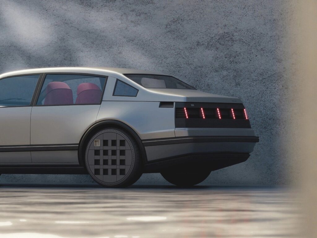 Side-rear exterior view of the Hyundai Second Star Project concept car, showing its clean metallic silver body, pixelated red LED taillights, and distinctive grid-pattern wheels. The composition highlights the vehicle’s blend of 1980s proportions with Hyundai’s modern pixel-inspired design language.