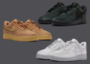Three pairs of Nike Air Force 1 Low shoes displayed on a dark gray background — one in wheat brown with a gum sole, one in deep forest green with black accents, and one in clean white with a light gray sole — showcasing the Workboot-inspired colorways and premium leather construction.