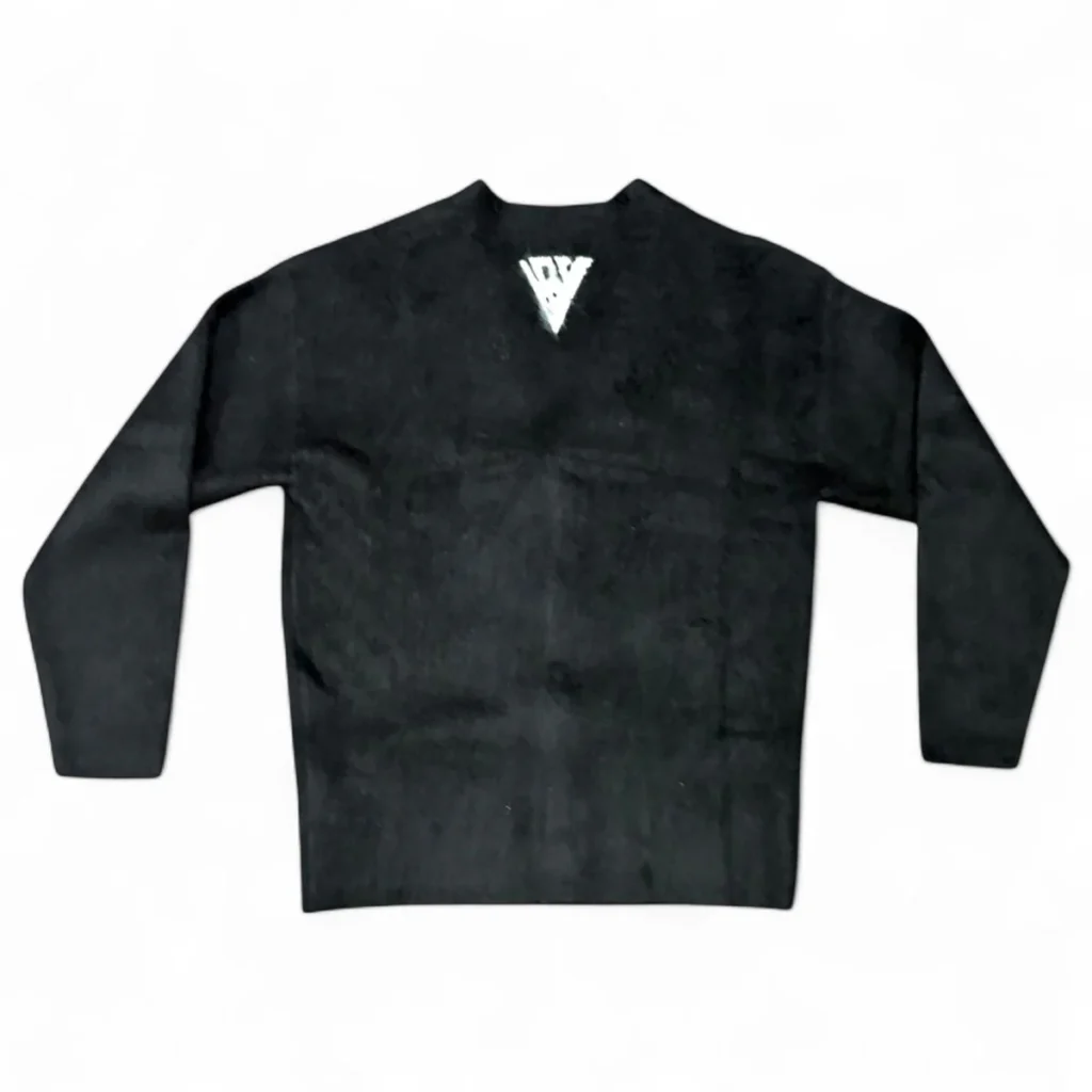 Back view of the black VALABASAS cardigan featuring a clean surface with a small triangular logo below the collar