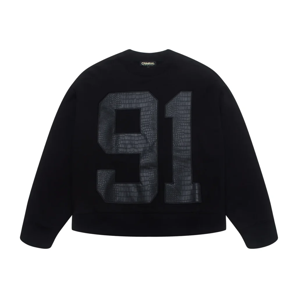 Front view of the black Criminal Damage “Animal 91” Sweatshirt featuring an oversized embossed 91 graphic with a faux-animal textured finish across the chest