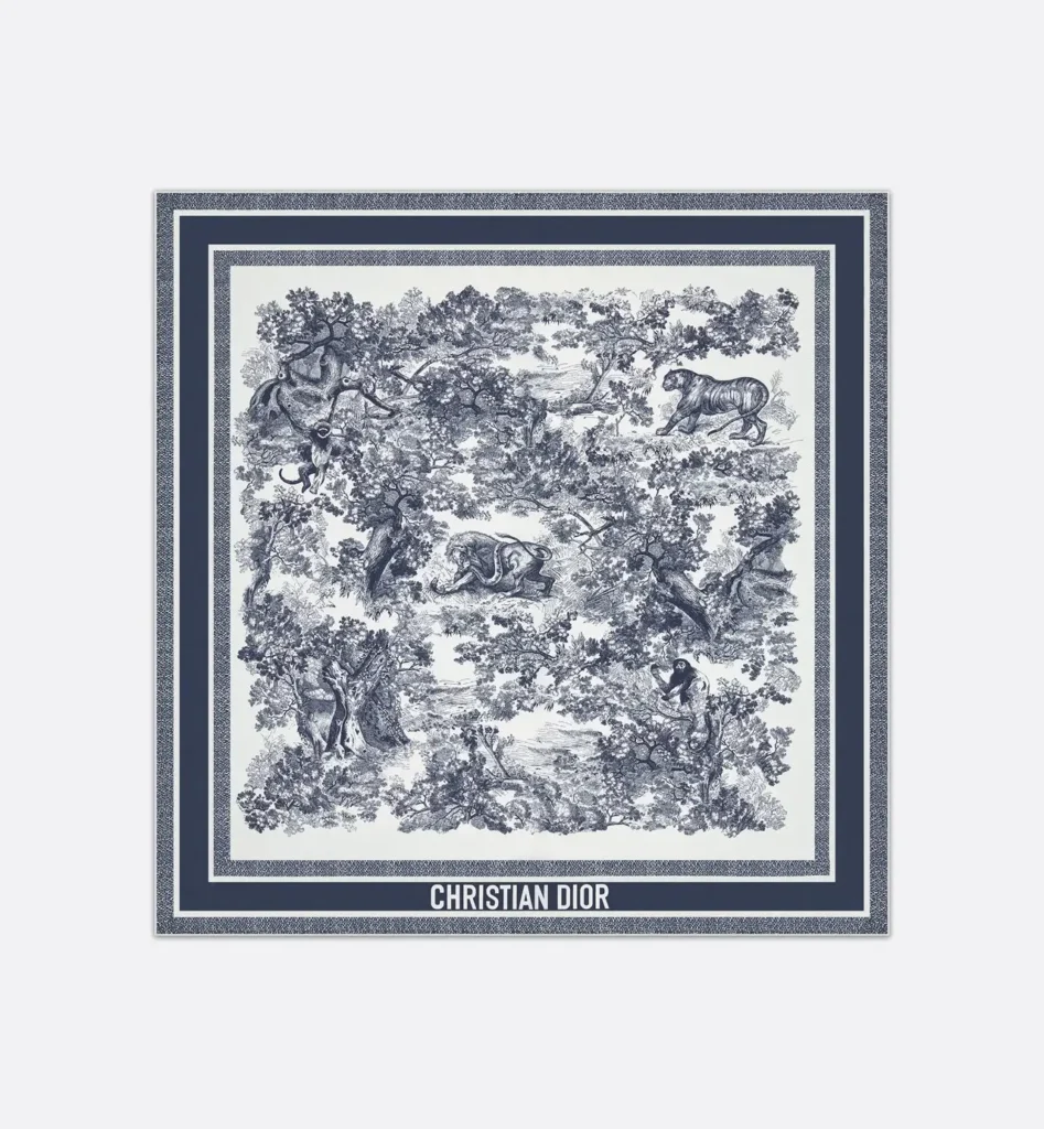 Dior Toile de Jouy Sauvage 90 Square Scarf in ivory and navy blue, featuring detailed wildlife illustrations framed by layered navy borders and the Christian Dior logo