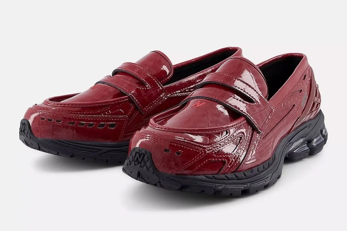 Glossy red croc-embossed New Balance 1906 LCS Loafer shown in a three-quarter view, featuring a patent-style upper, technical running sole in black, and a hybrid loafer-sneaker silhouette