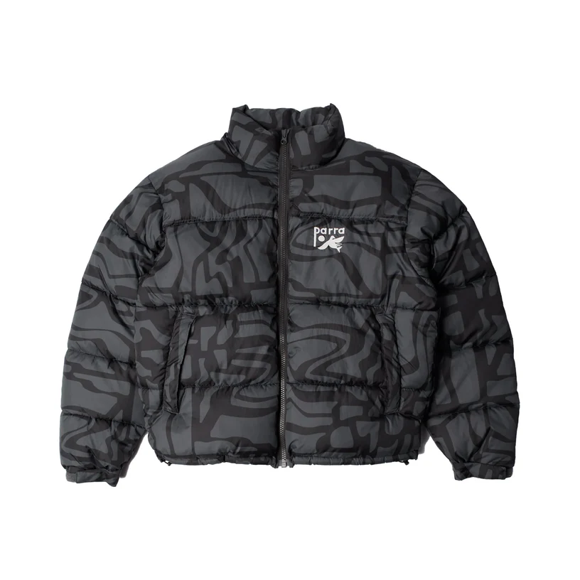 Front view of the By Parra Men’s Broken FTP Puffer Jacket featuring a black and charcoal abstract broken-line graphic print with a white Parra logo on the left chest