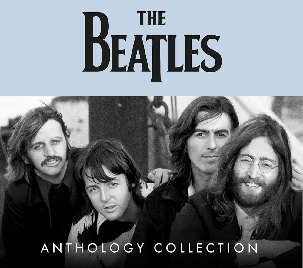 A black-and-white archival photograph of a famous 1960s rock band, showing four long-haired male musicians seated closely together, looking toward the camera. The image is used as the cover art for an anthology collection, with the band’s name displayed in large lettering above them