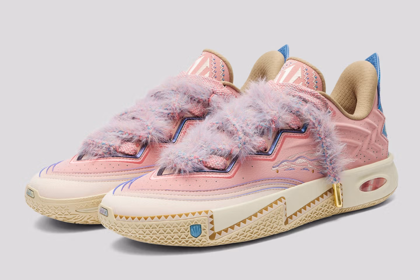 Side profile of the ANTA KAI 2 ‘Azurie,’ showing soft pink base, blue overlays, and NitroEdge cushioned sole