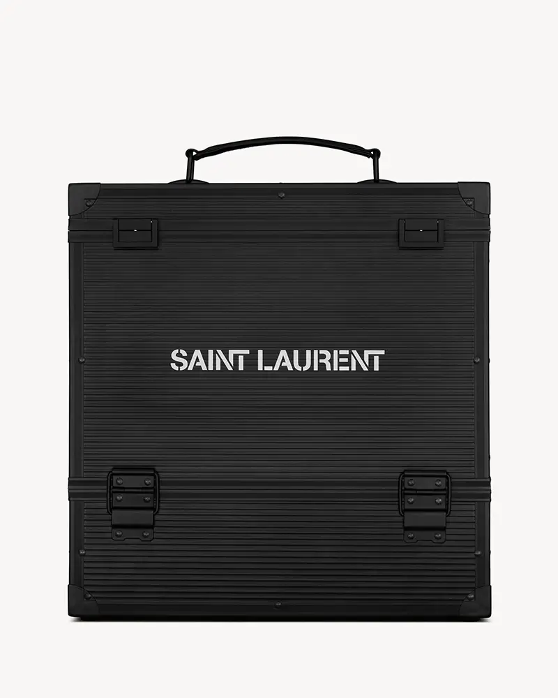 Black Saint Laurent Rive Droite vinyl advent calendar case with ribbed texture, metal latches, and the SAINT LAURENT logo stamped in white across the front