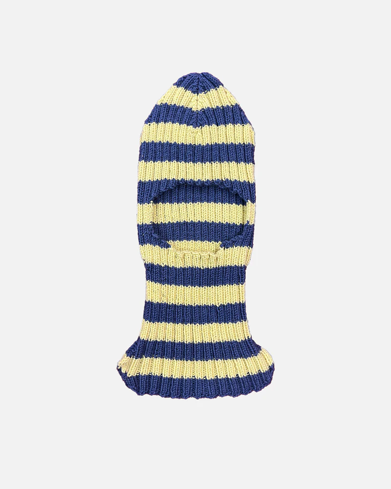 Stockholm Surfboard Club knitted balaclava in navy and pale-yellow stripes, featuring a ribbed wool texture and a single face opening, laid flat on a neutral background.
