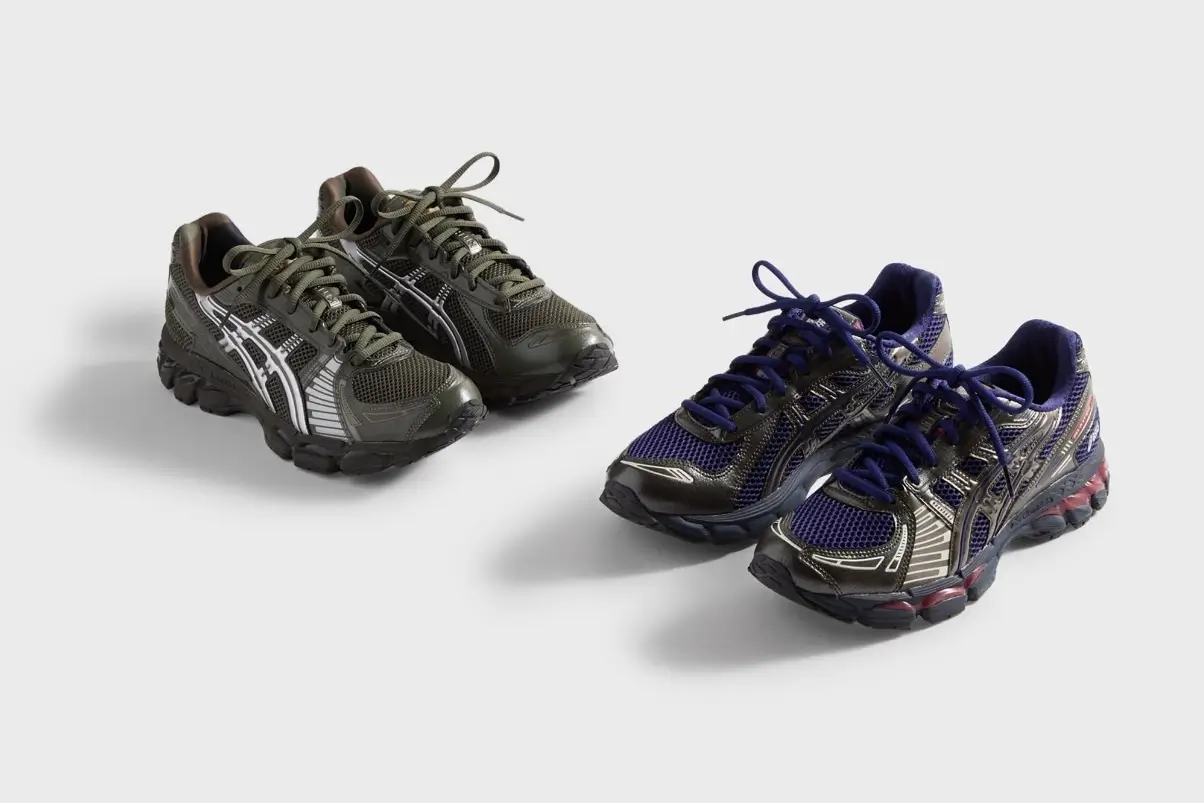 Side-by-side product photo of two ASICS GEL-KAYANO 12.1 sneakers from the KITH x Marvel vs. Capcom collaboration, featuring the olive Guile-inspired pair and the navy-and-red Captain America-inspired pair on a light grey background