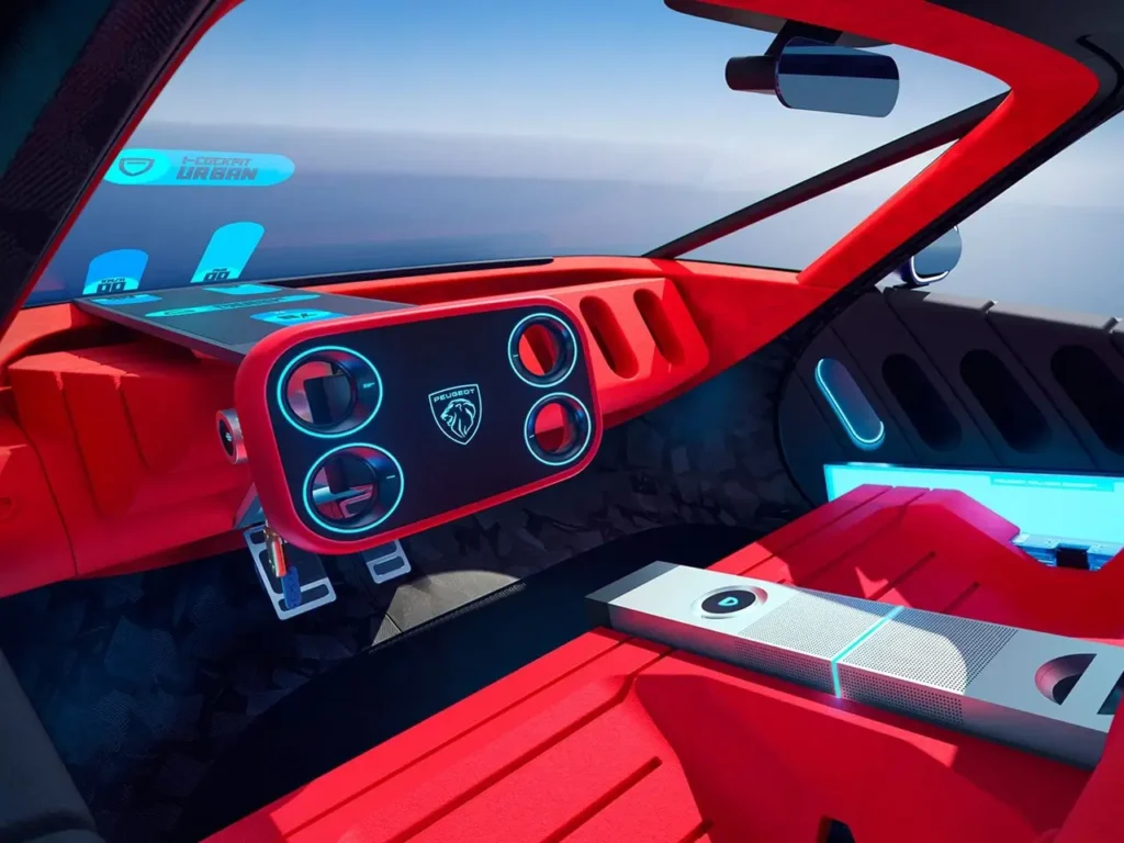 Interior view of the Peugeot Polygon Concept showcasing a bold red cabin with angular surfaces, a floating digital dashboard, circular illuminated vents surrounding a central Peugeot emblem, minimalist pedals, and ambient blue lighting integrated into the futuristic cockpit design