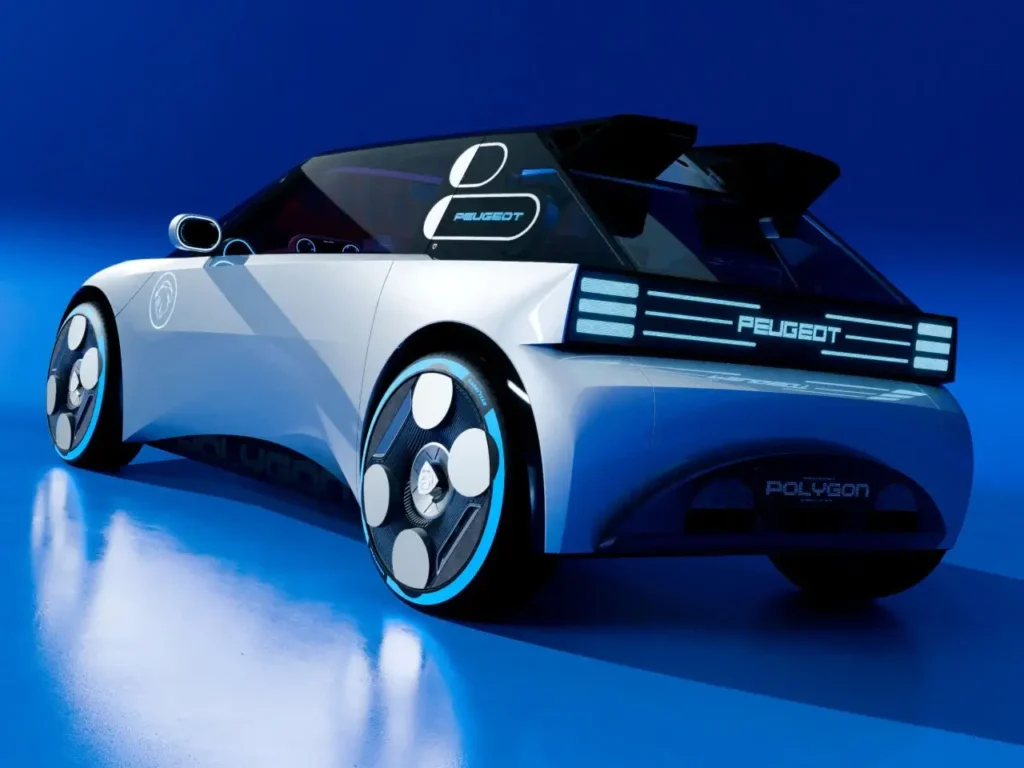 Rear three-quarter view of the Peugeot Polygon Concept EV in a blue-lit studio, featuring illuminated horizontal LED tail-light bars, pixel-style PEUGEOT lettering, aerodynamic wheels with circular white inserts, and a sharply sculpted silver body tapering toward a futuristic rear diffuser