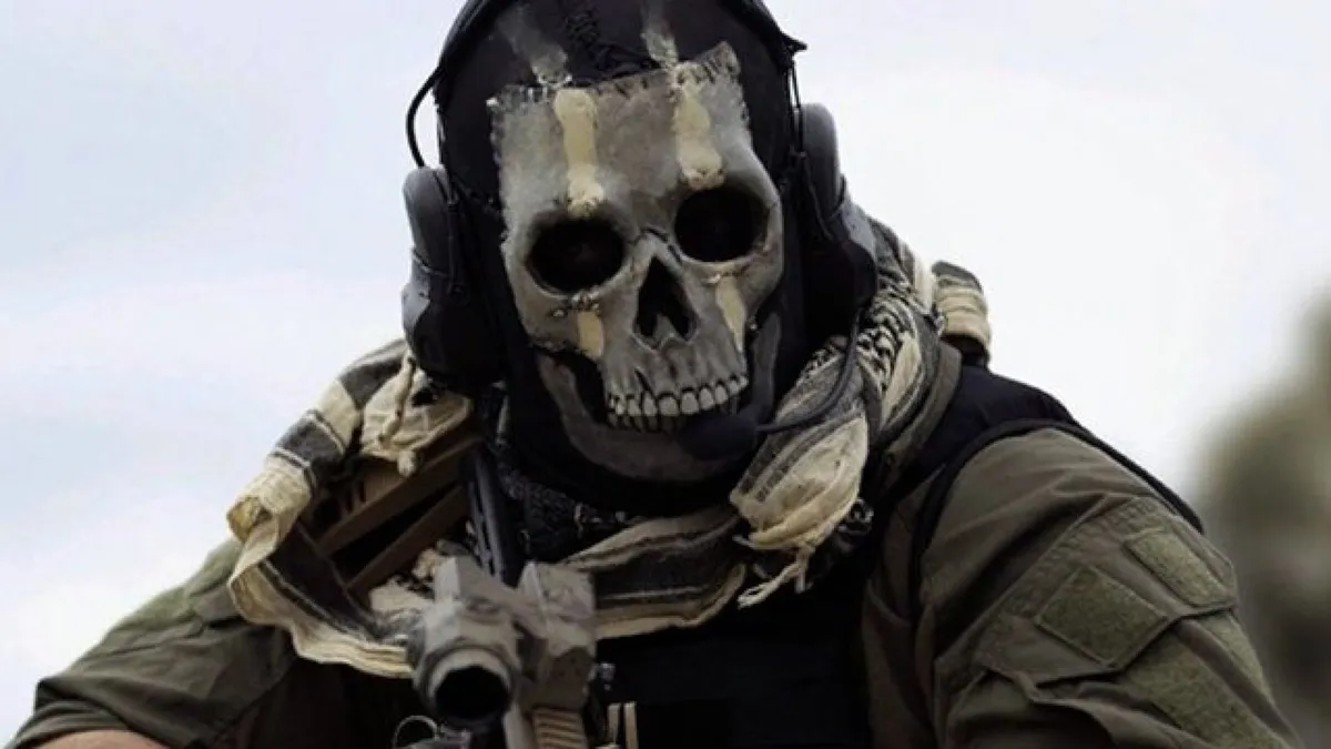 A soldier wearing tactical gear and a skull-patterned balaclava aims his weapon forward. The figure, inspired by the “Ghost” character from Call of Duty: Modern Warfare, has a rugged headset, a tan scarf, and a dark combat uniform, evoking the gritty realism and intensity of the game’s battlefield aesthetic.