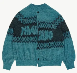 Front view of the Christmas Sweater Rave Blue, a brushed mohair knit featuring a misaligned jacquard logo across the chest with geometric blue and black patterning, buttoned at the center and displayed flat on a neutral background