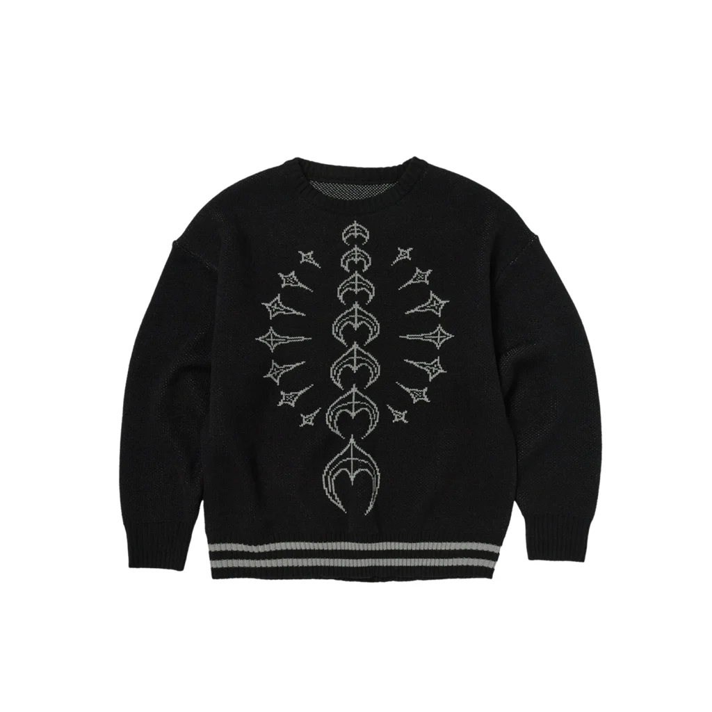 Front view of the Thug Club TC Bone Knit Sweater in black, showcasing a detailed gray spine-inspired bone motif running vertically down the center, with ribbed cuffs and a striped hem for structure
