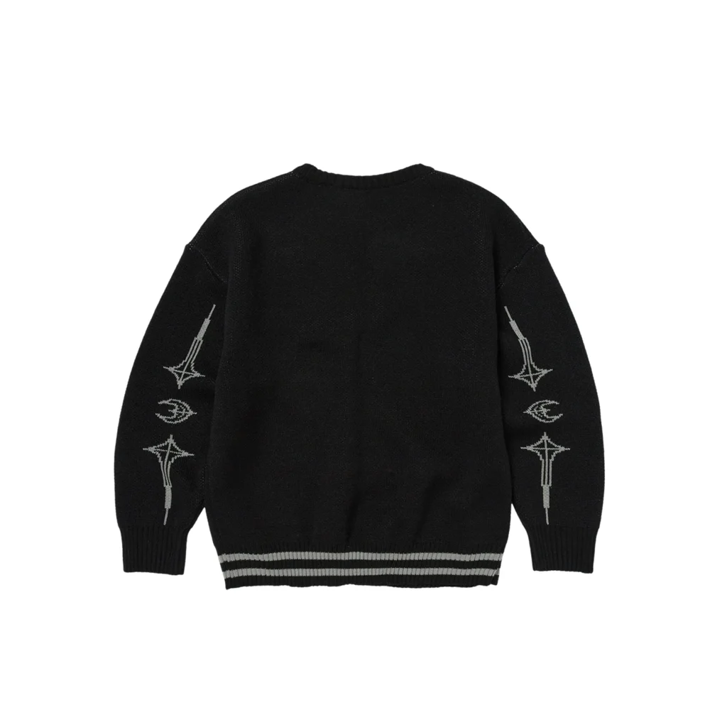Back view of the Thug Club TC Bone Knit Sweater in black, featuring light gray embroidered graphics along the sleeves including skeletal and abstract weapon-like motifs, ribbed cuffs, and striped hem detailing