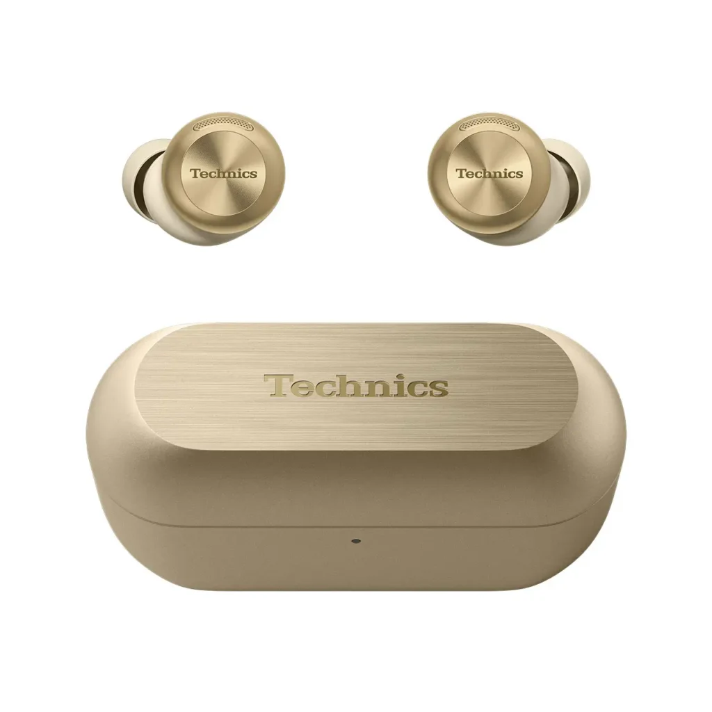 Top-down view of the Technics EAH-AZ100 earbuds in Champagne Gold alongside their matching charging case, showcasing the brushed metallic texture, engraved Technics logo, and cohesive premium finish across all components