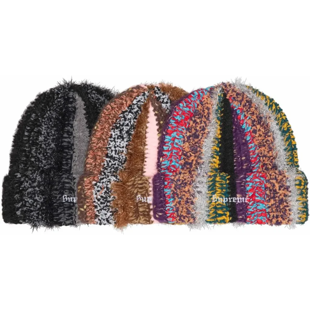 A lineup of Supreme Fall/Winter 2025 tinsel stripe beanies in multiple colorways, featuring fuzzy textured knit patterns and small embroidered Supreme logos on the cuffs