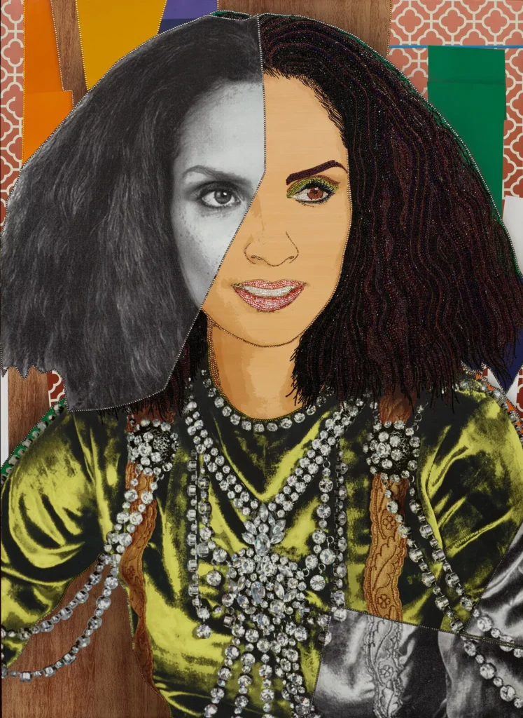 Mickalene Thomas, The Inversion of Racquel #2 (2021), mixed media portrait combining rhinestones, acrylic, and photographic collage; the composition splits the subject’s face between grayscale and color, set against patterned backgrounds and adorned with jeweled textures
