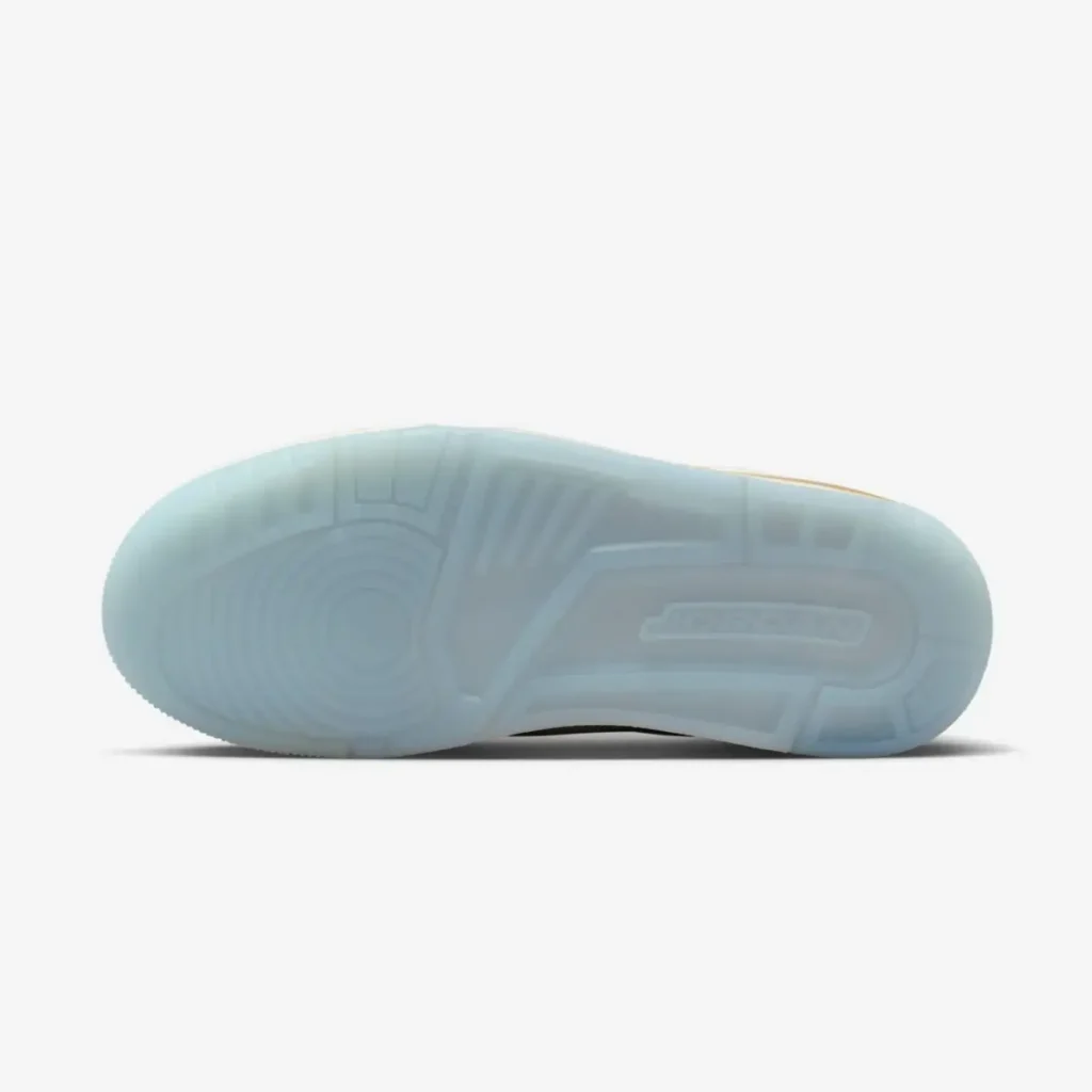 Underside view of the Air Jordan 3 “Champagne & Oysters” showing its icy translucent blue outsole with circular traction patterns and molded detailing against a clean white background