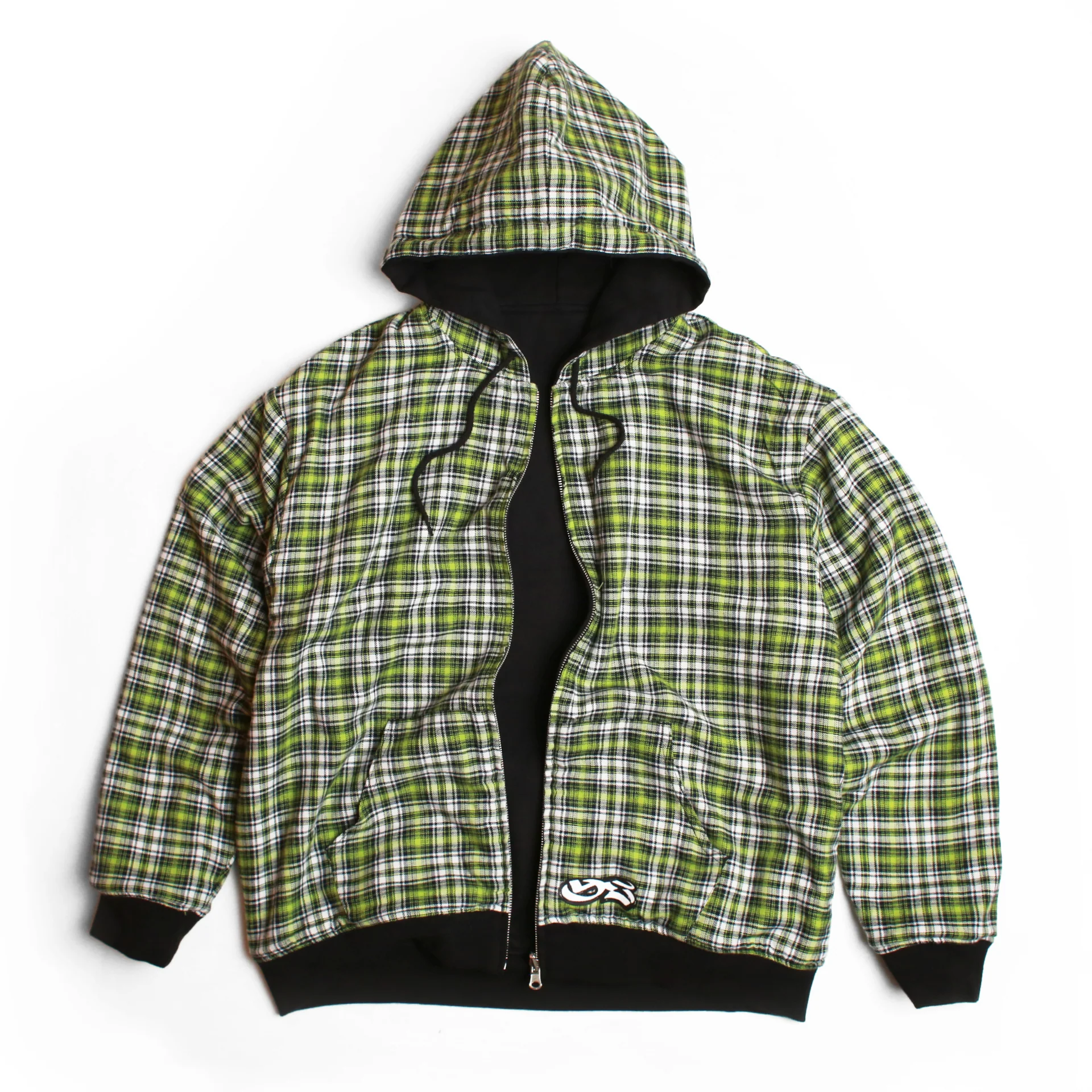 Reversible Yard Sale hoodie featuring a green and black plaid flannel exterior with a black inner layer, shown unzipped with a hood and ribbed cuffs on a white background