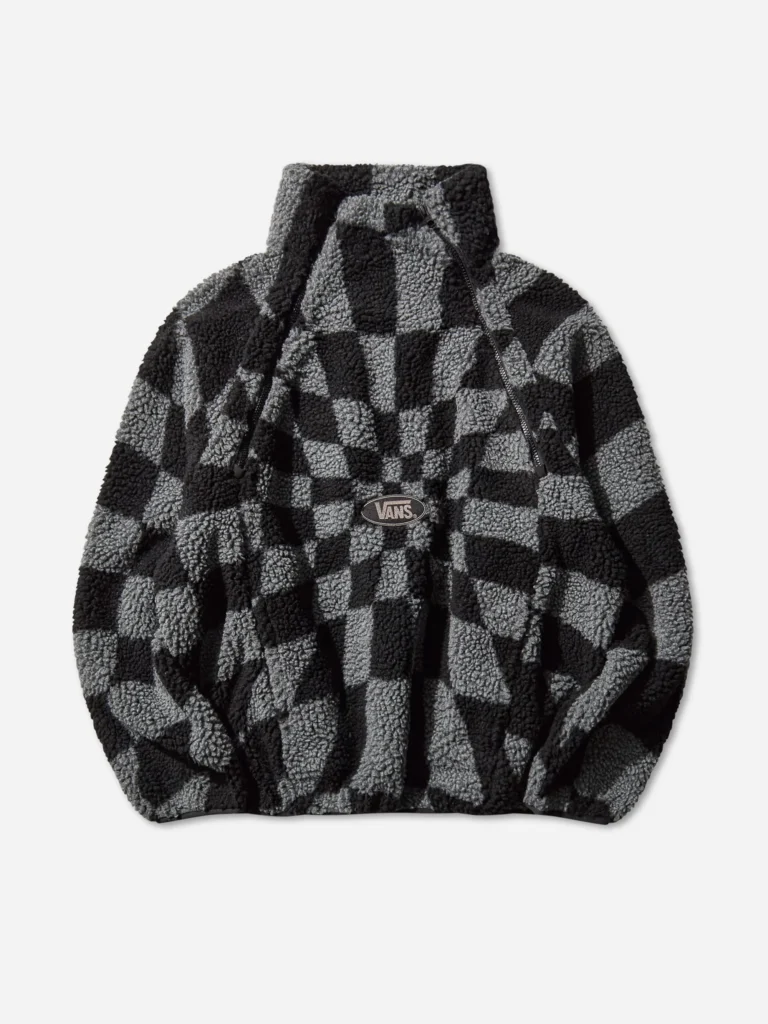 Vans x Slam Jam “Act of Disagreement” Relief Check Fleece Jacket in Smoked Pearl — plush jacquard sherpa fleece with tonal black and grey distorted checkerboard pattern, high collar with dual zippers, and embroidered Vans logo at the chest