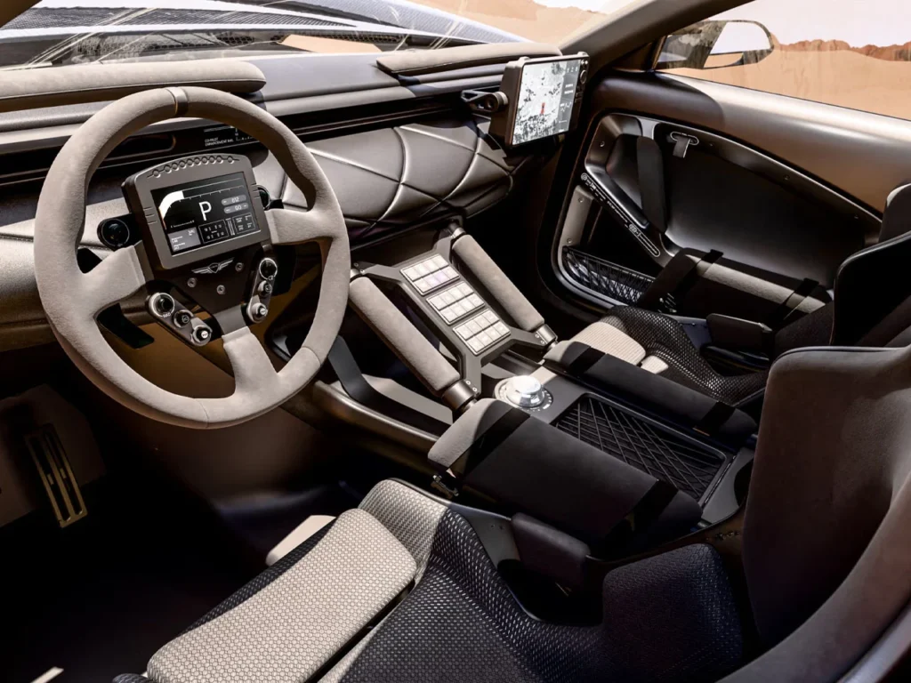 Interior cockpit of Genesis X Skorpio off-road supercar concept with racing steering wheel, desert visible through windshield