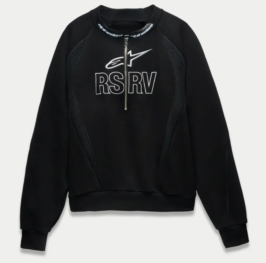 Front view of the black Alpinestars RSRV Champion sweatshirt featuring a half-zip collar, mesh side panels, ribbed cuffs and hem, and bold white RSRV and star logo embroidery across the chest
