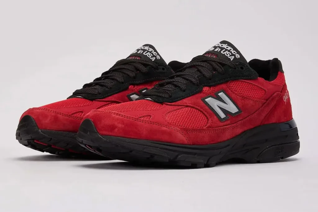 New Balance Made in USA 993 “Red Suede” sneaker featuring premium red suede overlays, breathable grey mesh underlays, embroidered N logo, and cushioned ABZORB midsole in a retro-inspired lifestyle runner silhouette