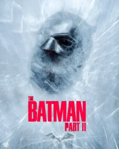 Promotional poster for The Batman: Part II showing Batman’s masked face frozen beneath cracked ice, with bold red title text “THE BATMAN PART II” centered over a cold, blue-white fractured background