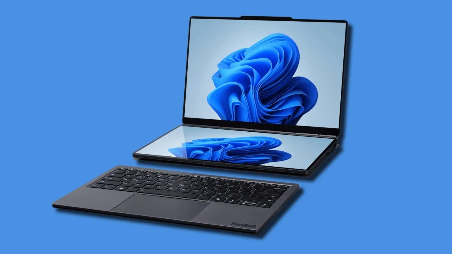 Lenovo ThinkBook modular laptop featuring a dual-screen design with a detachable keyboard, shown open against a blue background, displaying a blue abstract wallpaper on both the main and lower touchscreen displays