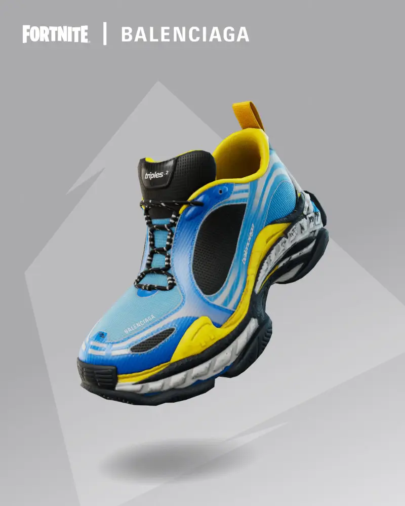 Balenciaga Triple S.2 sneaker rendered for Fortnite, shown in a floating studio composition with a blue mesh upper, black paneling, and vivid yellow lining. The design features stretch laces, layered distressed sole units, and visible “Balenciaga” and “triples-2” branding, highlighting the translation of the iconic chunky silhouette into a hyper-real digital object within the Fortnite collaboration