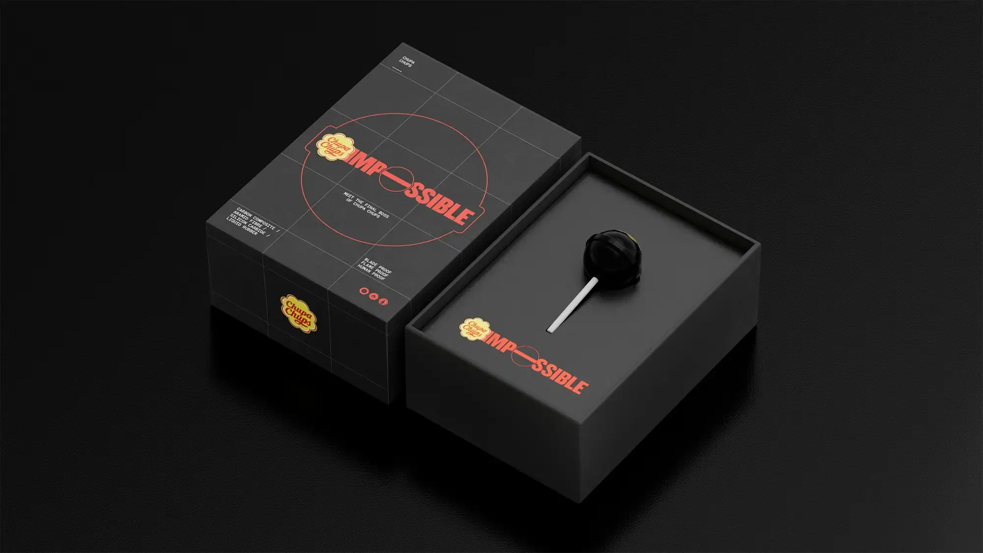 Black presentation box for the **Chupa Chups “Impossible” campaign featuring a matte black lollipop displayed inside minimalist packaging with red “IMPOSSIBLE” typography and the iconic Chupa Chups logo on a dark grid-patterned box