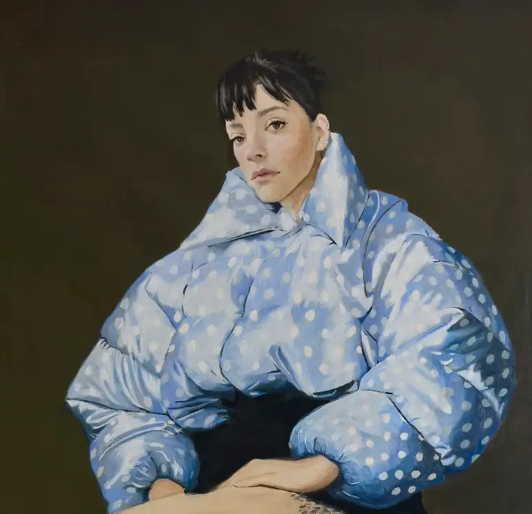 Painted portrait of Lily Allen wearing an oversized blue puffer jacket with white polka dots, seated against a dark background with a calm, slightly distant expression, created by Nieves González for the West End Girl album artwork