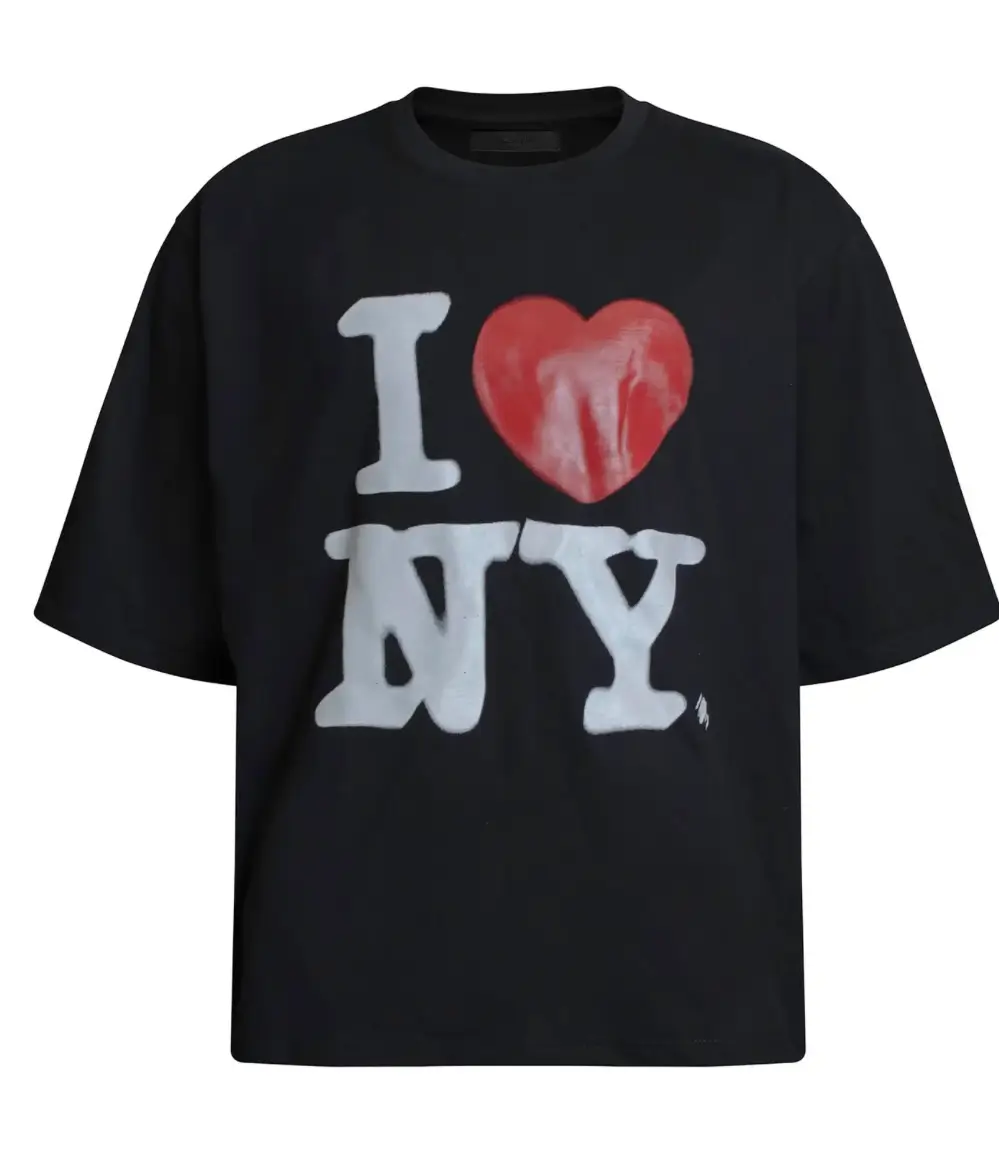 Black oversized T-shirt featuring a hand-painted “I Love NY” graphic with rough white lettering and a bold red heart, rendered in a graffiti-inspired, imperfect brush style on a clean front canvas