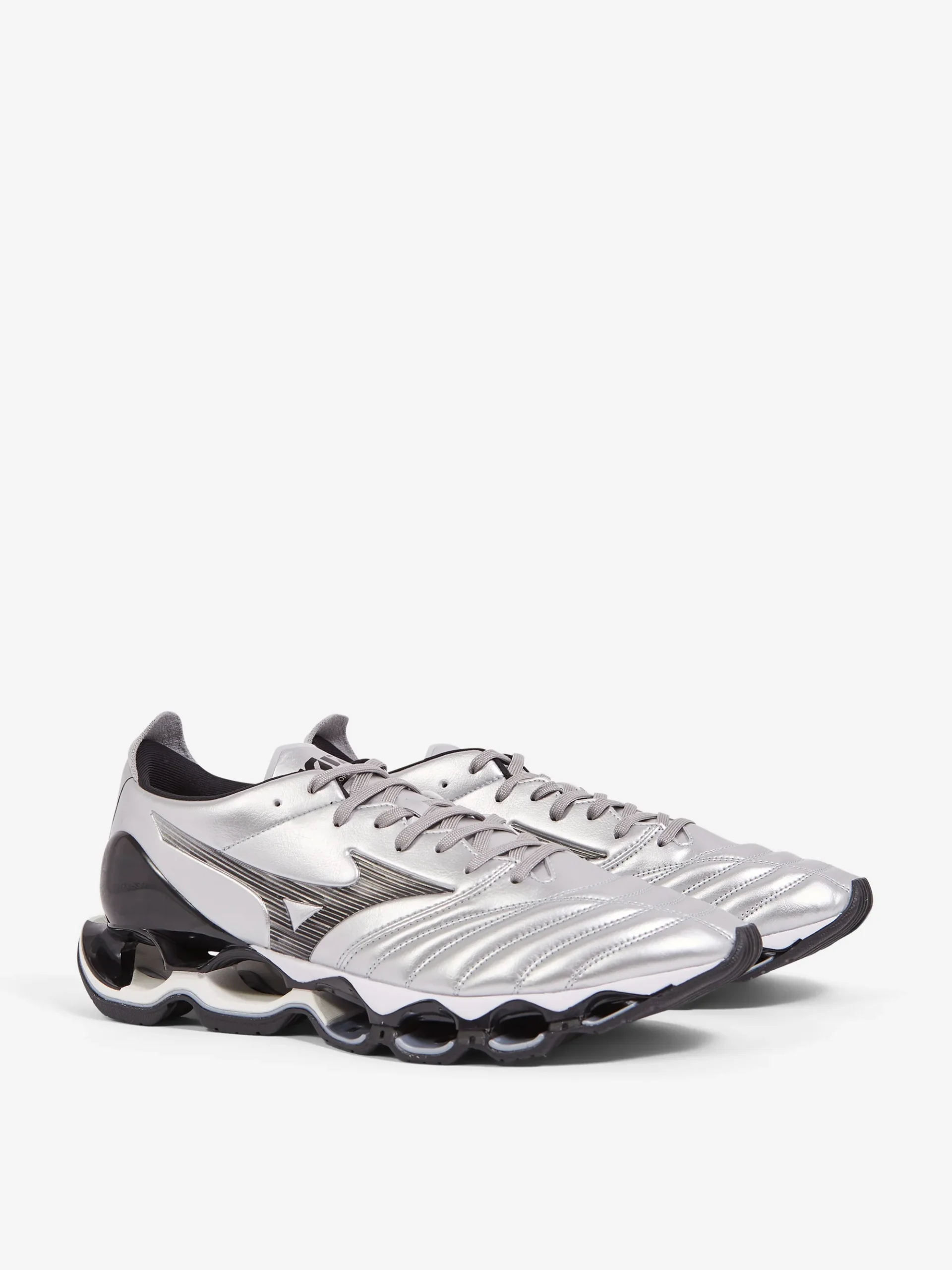 Angled view of the Mizuno Wave Prophecy Morelia Neo “Silver / Black” sneakers featuring metallic silver football-inspired upper, Mizuno RunBird logo, and Infinity Wave plate cushioning sole
