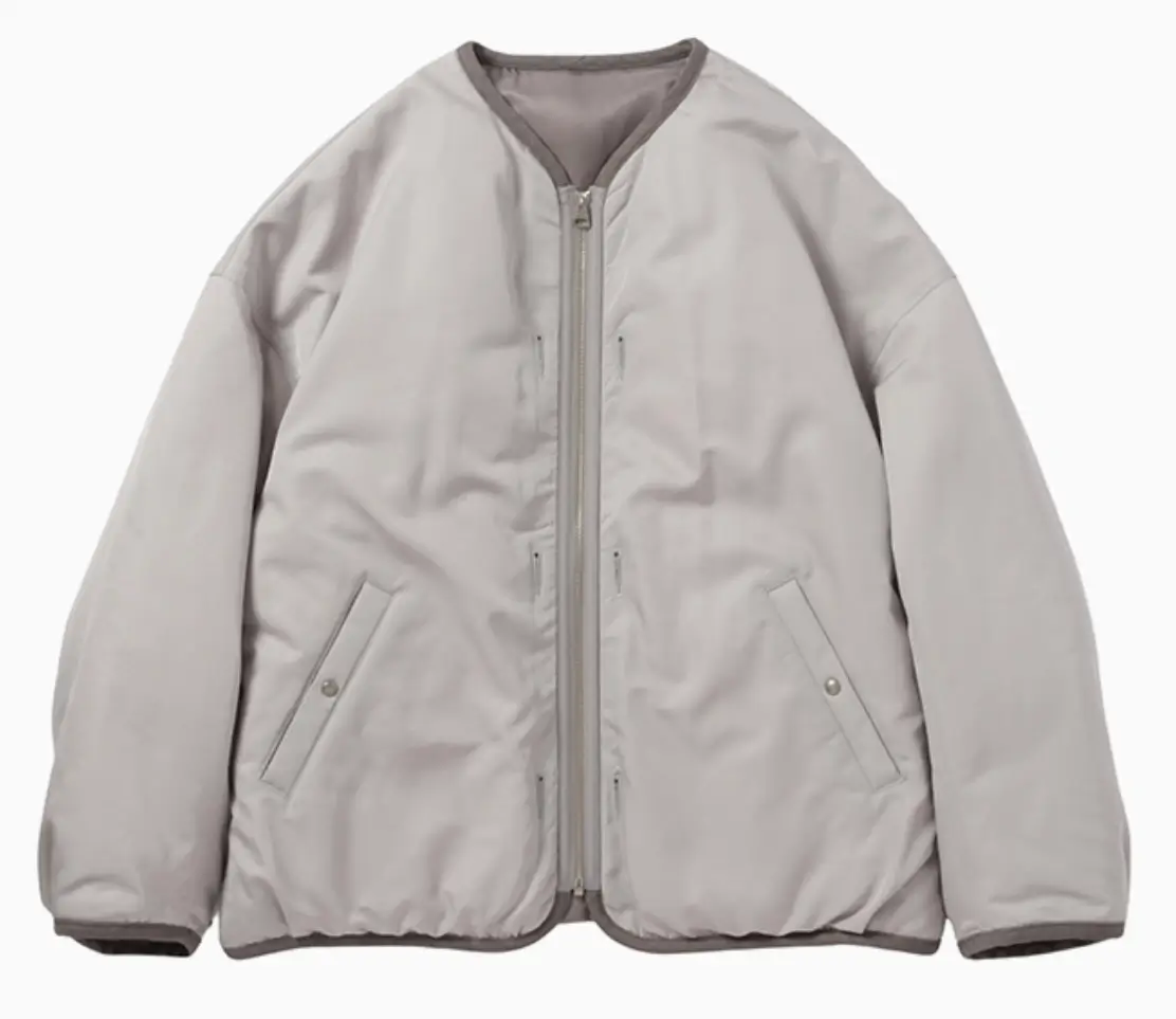 Front view of Visvim WMV Liner Down JKT W in silver with collarless design, zip closure, and angled flap pockets