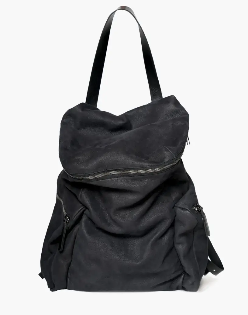 Ari Soho ENZO backpack in black nubuck leather with soft folded top, curved zipper closure, and minimalist shoulder straps