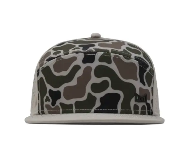 Front view of melin Trenches Icon HYDRO hat with camouflage crown, flat brim, and minimalist logo badge on the side