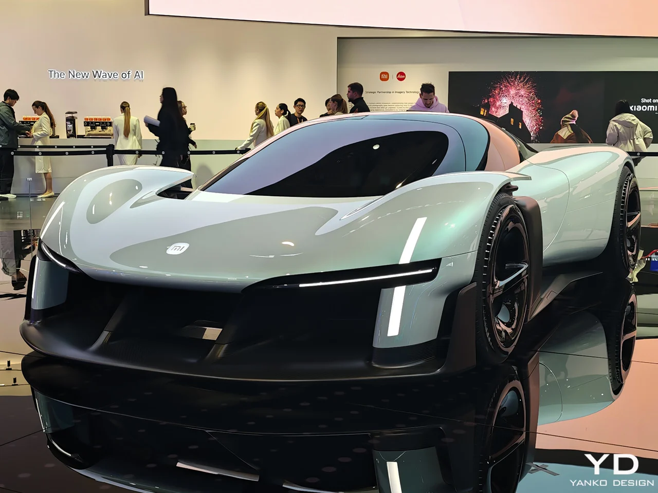 Front three-quarter view of the Xiaomi Vision Gran Turismo electric hypercar concept displayed at Mobile World Congress 2026, featuring sleek LED lighting, aerodynamic bodywork, and futuristic EV design