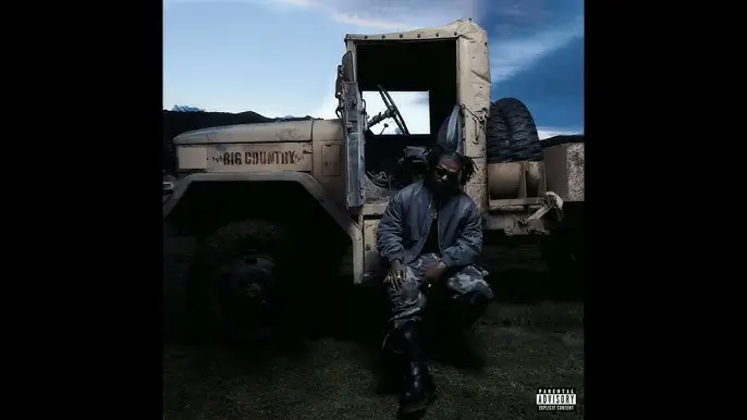 sosocamo, Album cover artwork showing rapper sitting beside a military-style truck labeled “Big Country” in a dark outdoor setting